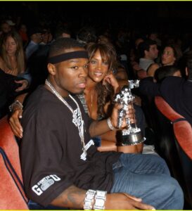 Celebrities sitting front row music awards show.
